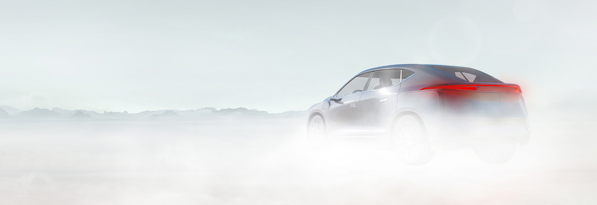 Person standing beside a car at sunset