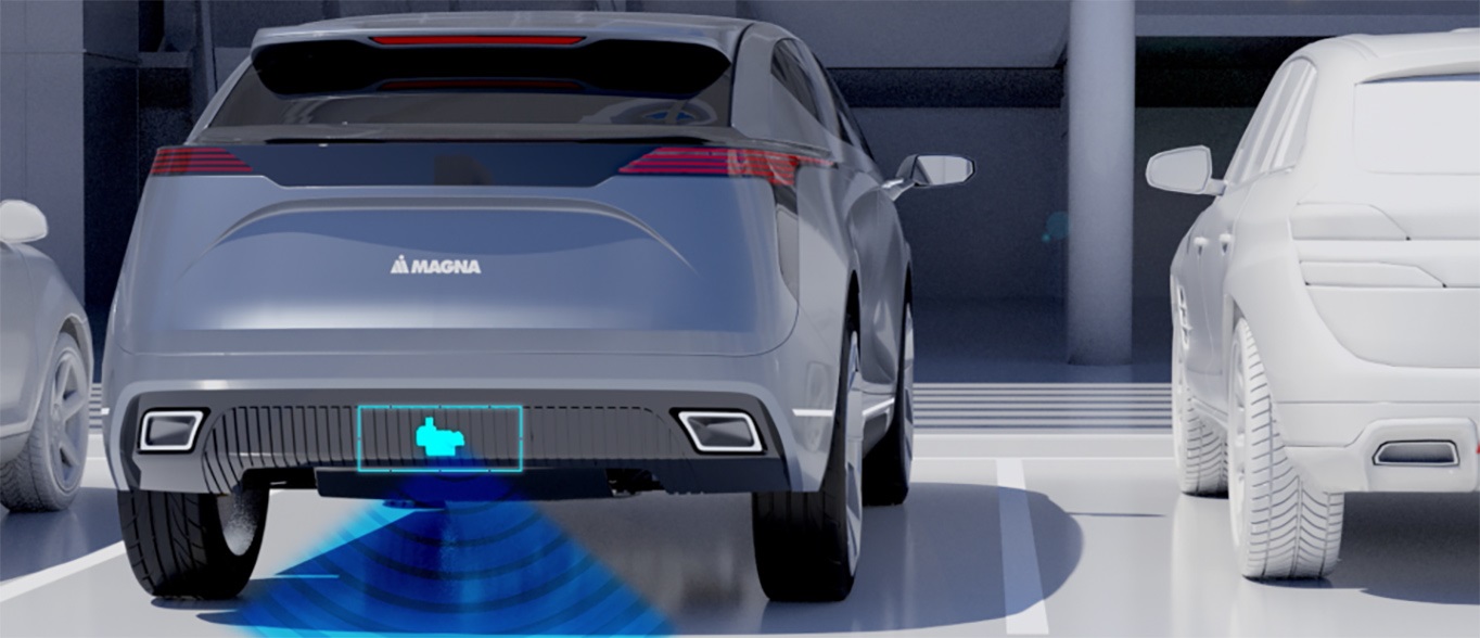 Picture of grey vehicle showing location of sensor to open liftgate module with foot