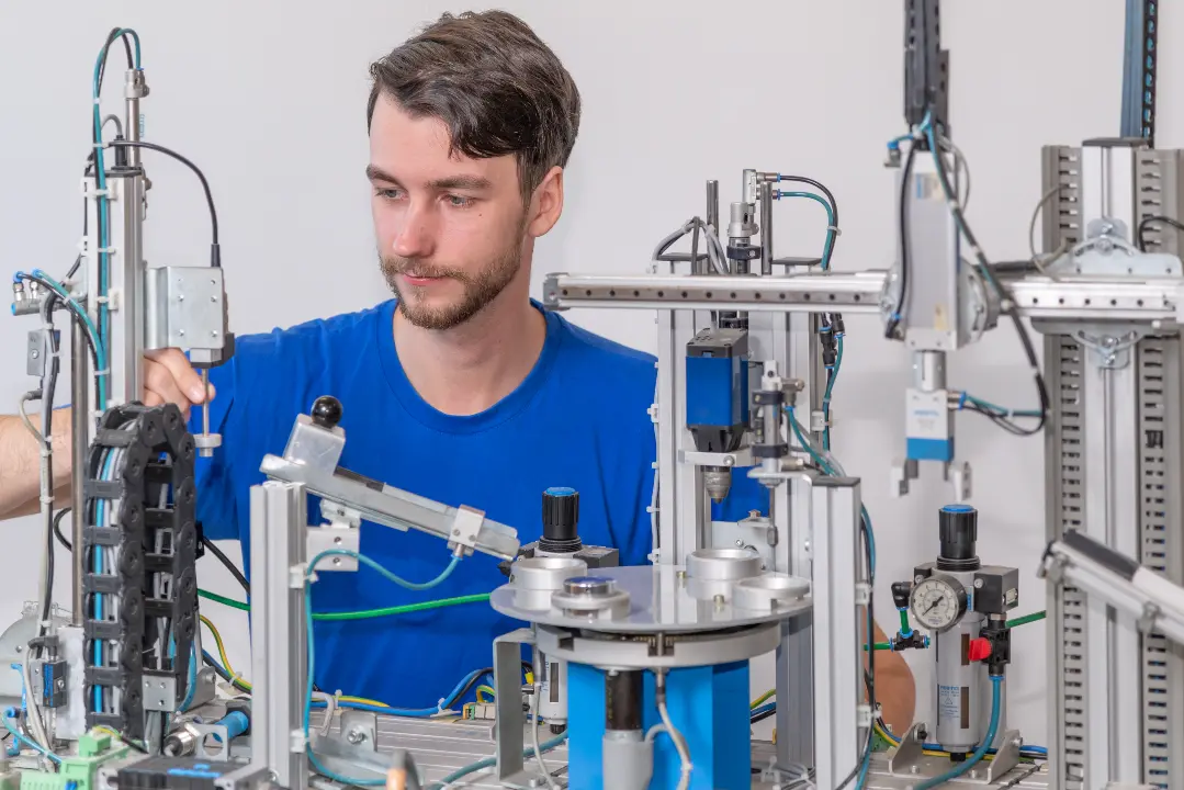 Young technician working on an automated machine setup