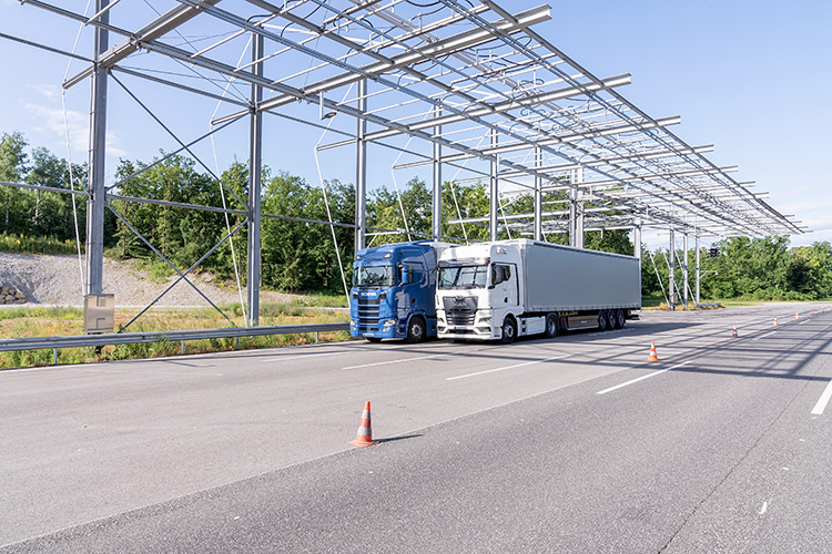 Two tracker trailers driving along a highway