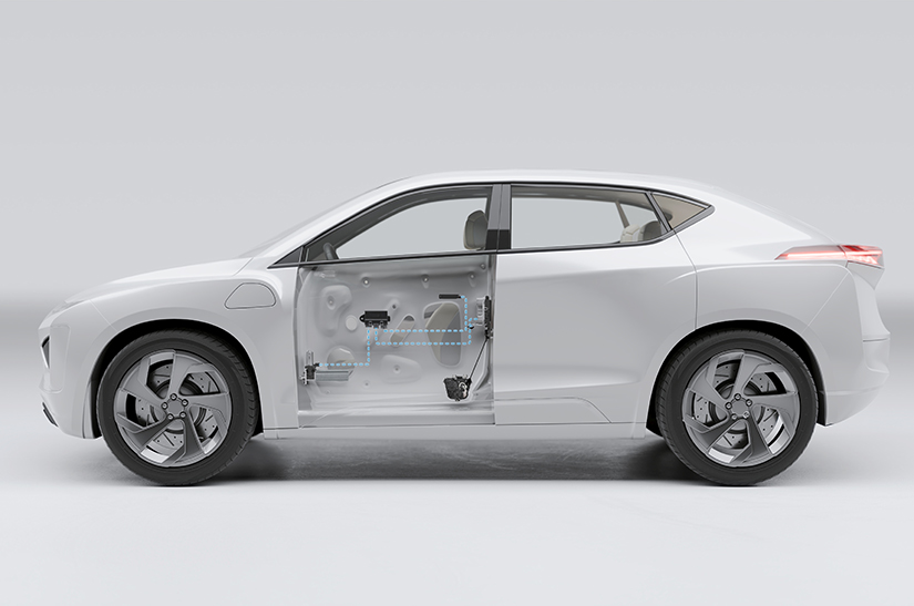 Grey vehicle with the driver door cut out showing with mechanisms for the power door system