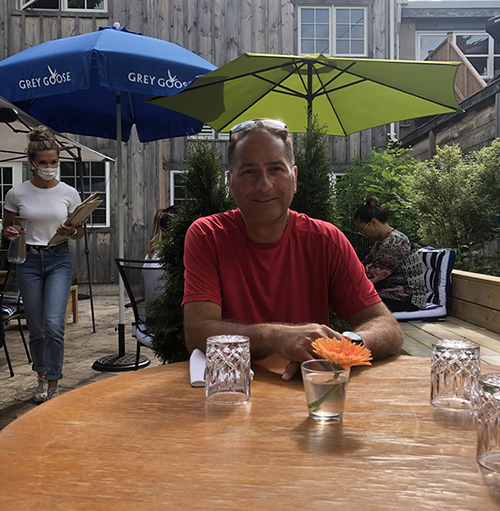 Michael Iannantuono at a restaurant sitting outside