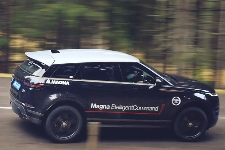 Magna EtelligentCommand vehicle driving along a tree lined road