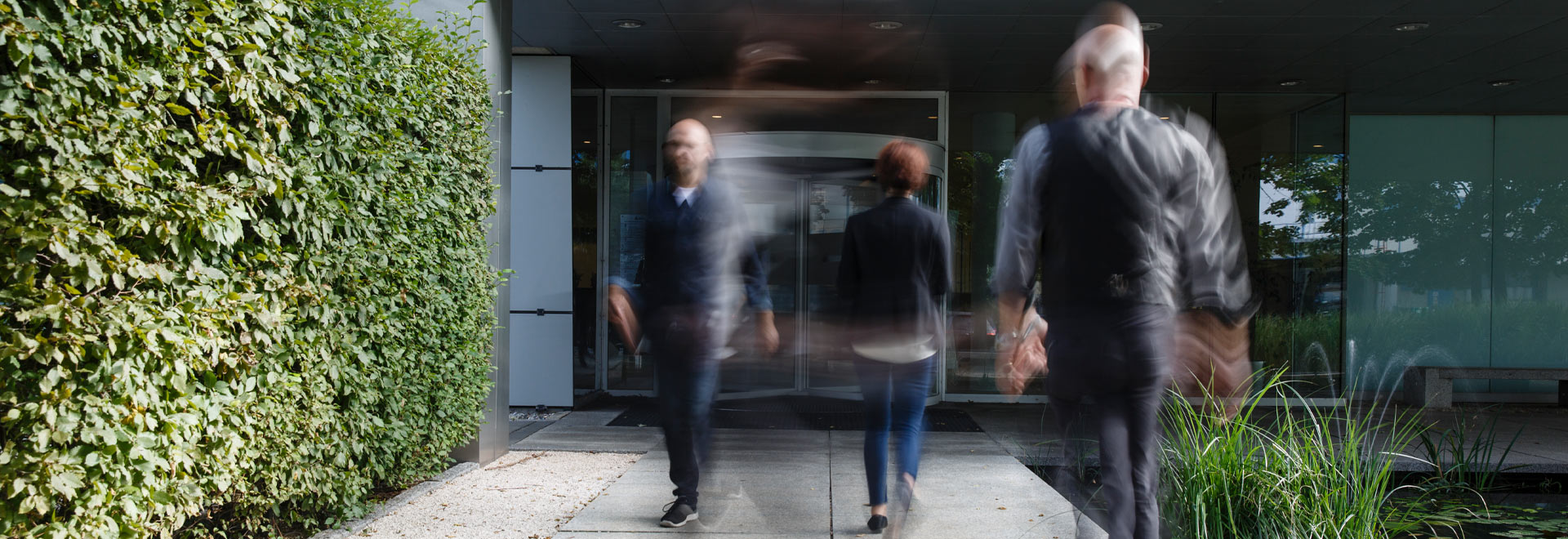 People leaving and entering a building